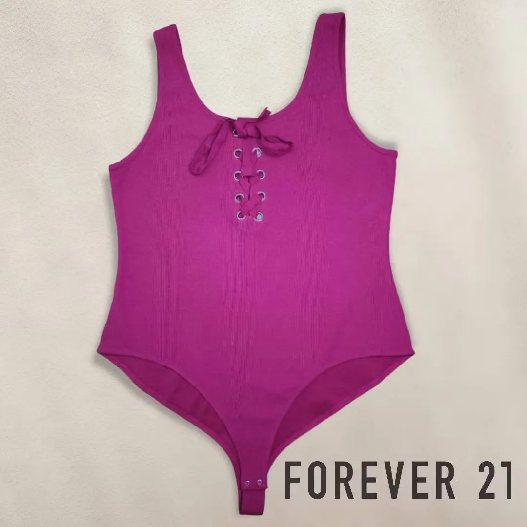 Deep pink lace bodysuit featuring a sleek silhouette, delicate lace fabrication, and playful ribbon accents. Shop Forever 21 on Dubailisit.