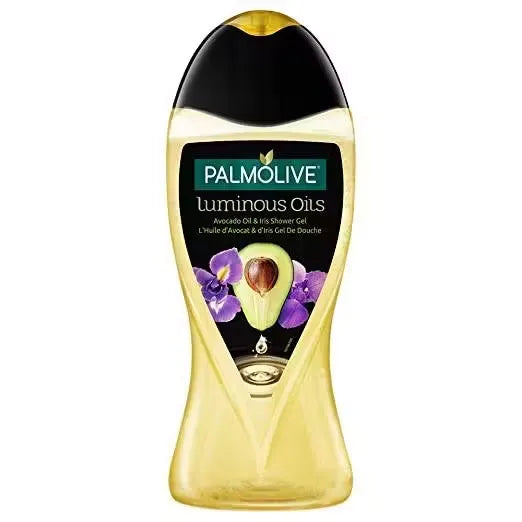 Green bottle with gold accents containing Palmolive Luminous Oils Avocado Oil & Iris Shower Gel (500ml). Close-up view showcasing luxurious lather and fresh ingredients.