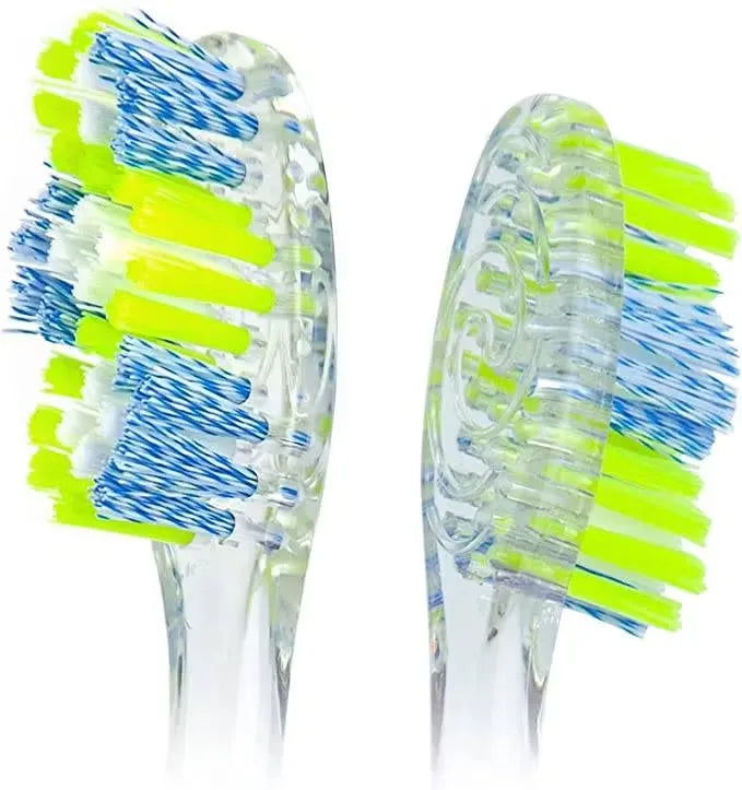 Pink Colgate Twister toothbrush with a close-up view of the twisted bristles and ergonomic handle.