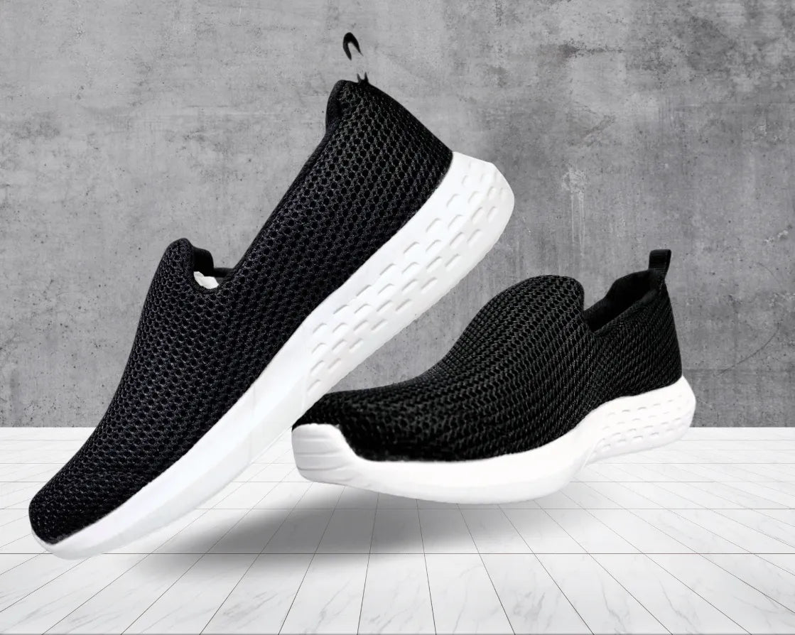 Playboy Black Slip-Ons: Effortless chic meets comfort, perfect for everyday style (mention size if relevant).Slip on instant style and comfort, no laces required.black, comfortable, chic, everyday wear, versatile.