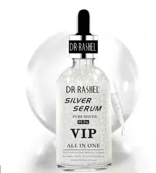 Close-up of a silver bottle with blue label and dropper dispenser, labeled "Dr. Rashel Silver Serum 99.99% Pure Silver VIP All-In-One Skincare - 50ml." Droplets of serum falling onto a person's hand.