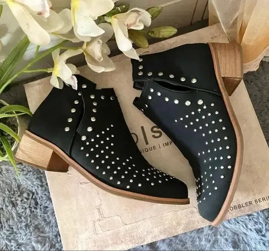Black Studded Ankle Boots: Elevate your style with edgy & versatile footwear.Pair these versatile boots with dresses, jeans, or skirts.Black, studded, ankle, fashion, trendsetting, comfortable.