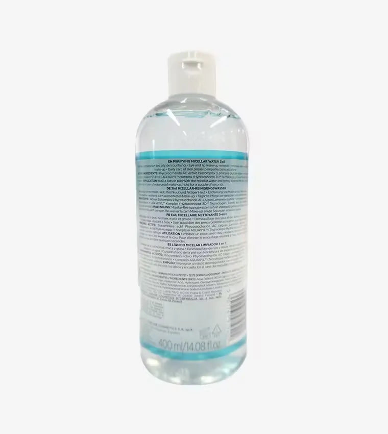 Close-up photo of a white plastic bottle with pink label, dispensing Eveline Purifying Micellar Water onto a cotton pad. Eveline Purifying Micellar Water 400ml bottle featuring gentle cleansing and revitalizing formula for refreshed, clean skin.