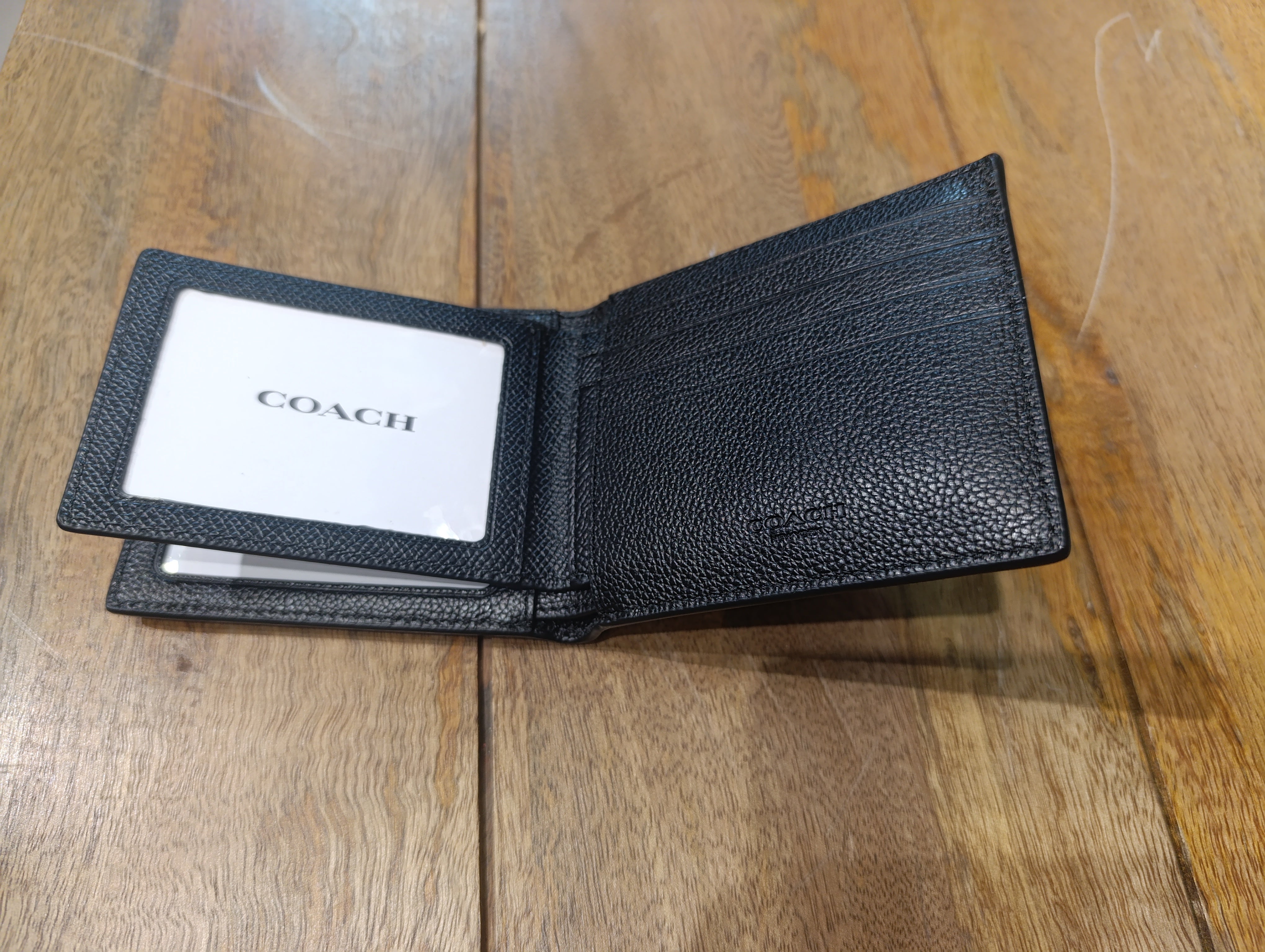 Coach small bifold wallet made of black leather
