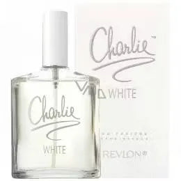 White glass bottle of Revlon Charlie White Eau De Toilette with silver cap, lying on its side on a white background.