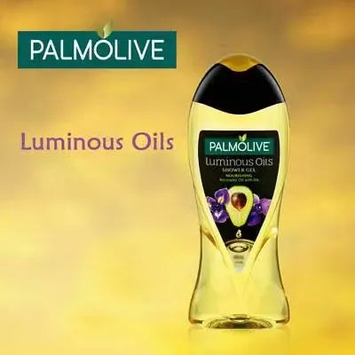 Green bottle with gold accents containing Palmolive Luminous Oils Avocado Oil & Iris Shower Gel (500ml). Close-up view showcasing luxurious lather and fresh ingredients.