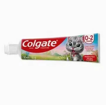Close-up of a pink tube of Colgate Anticavity Strawberry Toothpaste (50ml) with a smiling child on the label. Ideal for children aged 0-2 years.