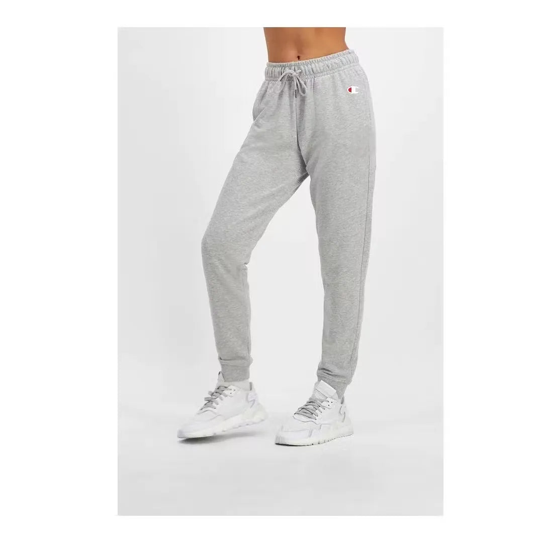Champion women's grey track pants for comfort and style. Features cuffed ankles and iconic logo. Shop on Dubailisit!