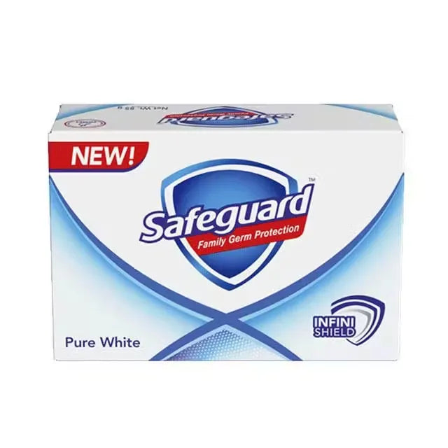 White bar of Safeguard Pure White Soap with blue accents and Safeguard logo, lying on a white background.