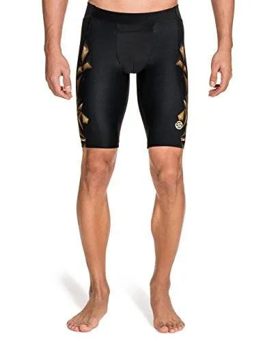 Men's black and gold Skins A400 1/2 tights with compression technology for performance and comfort.