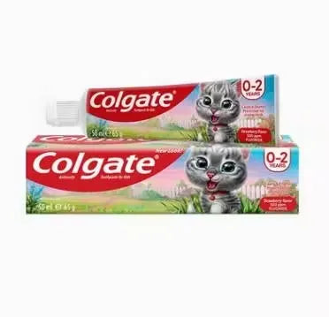 Close-up of a pink tube of Colgate Anticavity Strawberry Toothpaste (50ml) with a smiling child on the label. Ideal for children aged 0-2 years.