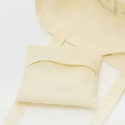Gloo Planet B printed fold-up shopper bag made from sustainable materials. Bag is folded and displayed against a white background. Gloo Planet B eco-friendly shopper bag with colorful print, folded compactly on a white background. Perfect for reducing plastic waste.