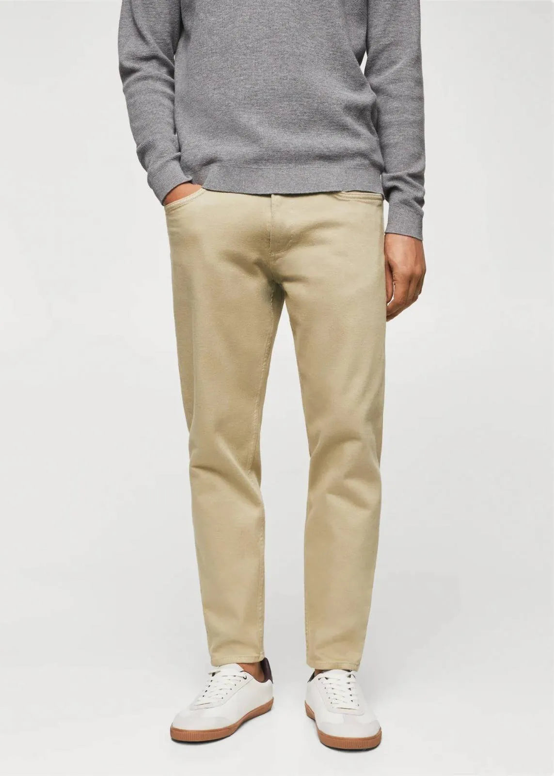 Modern Beige Jeans: Mango's tapered, cropped fit in versatile beige (mention size if relevant).Tapered design for a defined silhouette, cropped length for a modern touch.Consider mentioning any specific details like the fabric composition 