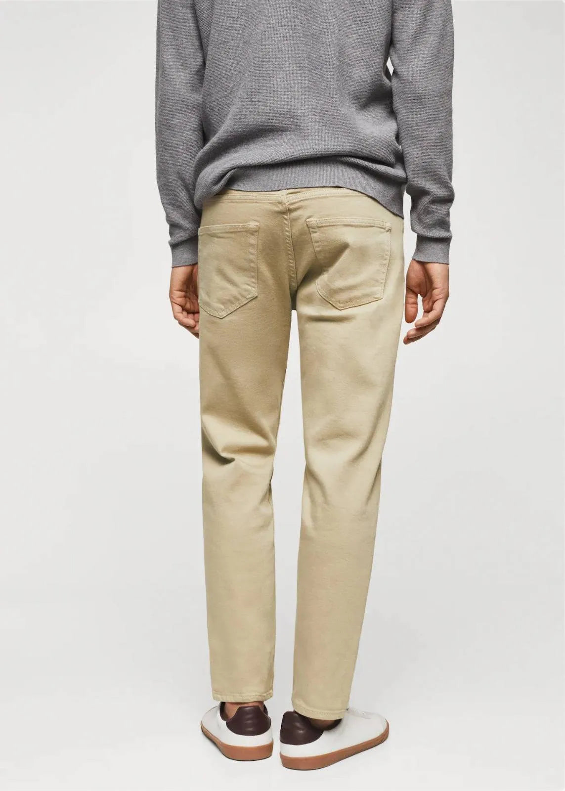 Modern Beige Jeans: Mango's tapered, cropped fit in versatile beige (mention size if relevant).Tapered design for a defined silhouette, cropped length for a modern touch.Consider mentioning any specific details like the fabric composition 