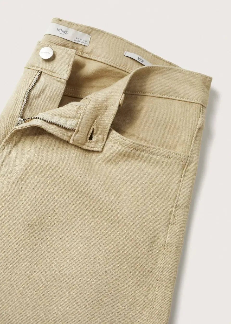 Modern Beige Jeans: Mango's tapered, cropped fit in versatile beige (mention size if relevant).Tapered design for a defined silhouette, cropped length for a modern touch.Consider mentioning any specific details like the fabric composition 