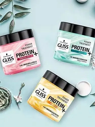 Blue bottle of Schwarzkopf Gliss Hair Repair with Babassu Nut Oil (400ml) featuring a woman with healthy, shiny hair.