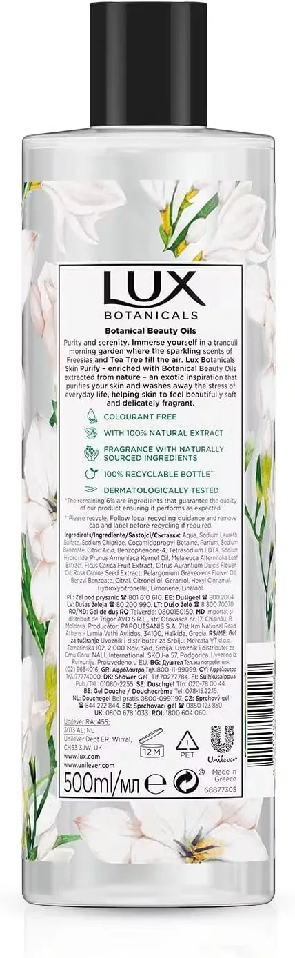 Lux Daily Shower Gel bottle (500ml) featuring vibrant design with freesia flowers and tea tree leaves. Close-up view of gel dispensing onto hand, creating a gentle lather.