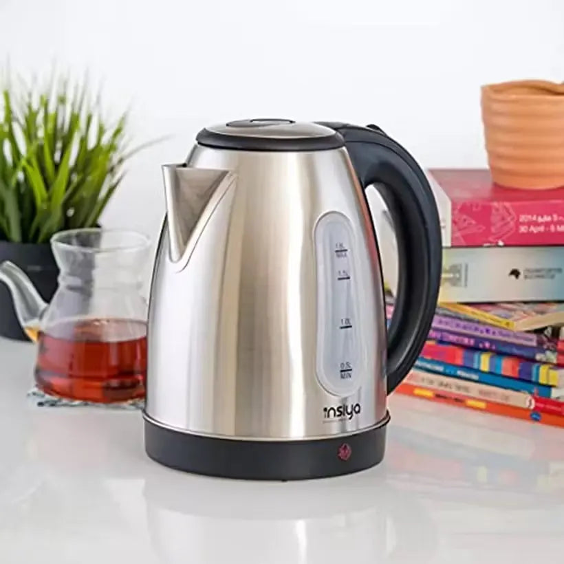 Insiya 1.8L electric kettle pouring water into a mug, highlighting its convenient spout and rapid boiling. Upgrade your kitchen with the stylish Insiya 1.8L electric kettle, featuring fast boiling and a premium design.