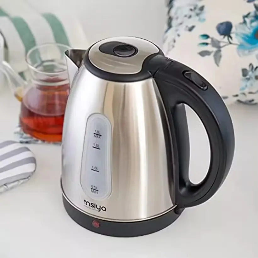 Insiya 1.8L electric kettle pouring water into a mug, highlighting its convenient spout and rapid boiling. Upgrade your kitchen with the stylish Insiya 1.8L electric kettle, featuring fast boiling and a premium design.