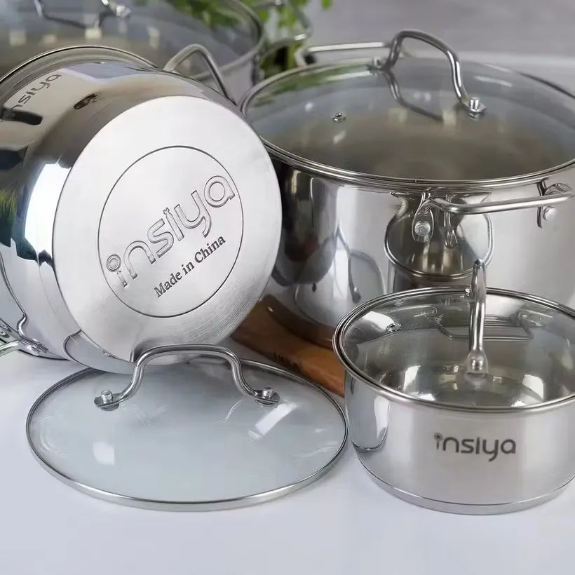 Insiya 8-piece stainless steel cookware set: Cook and shine in your kitchen.  Sleek and durable stainless steel pots and pans for everyday cooking.  Elevate your culinary game with this versatile 8-piece cookware set. Highlight specific pieces in the set, like a large pot or frying pan.  Showcase the shiny polished finish of the stainless steel. Shine in your kitchen! Get the Insiya 8-piece cookware set today.