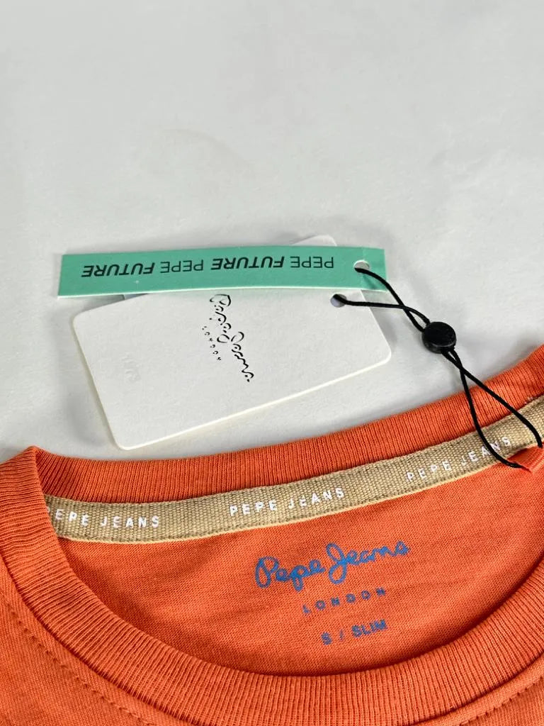 Pepe Jeans Squash T-Shirt: Boost your style with this bold orange tee, offering comfort and a vibrant pop of color (PM508697).Make a statement in this eye-catching orange t-shirt from Pepe Jeans, perfect for casual wear . Vibrant orange t-shirt for men, offering both style and comfort 