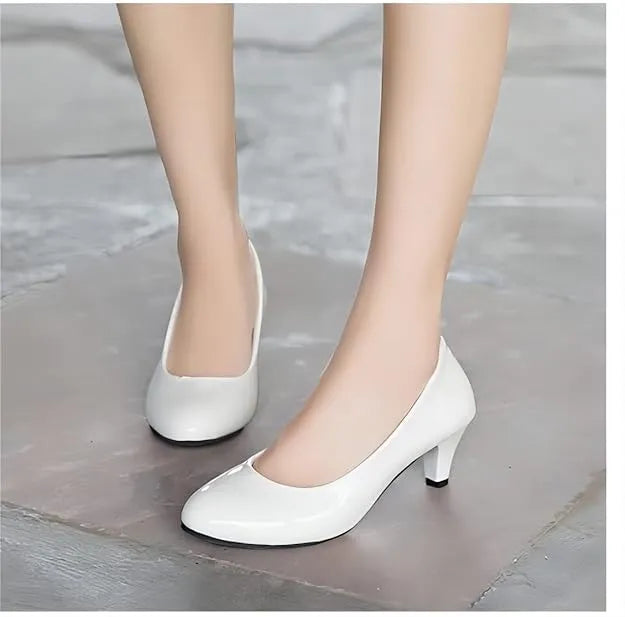 White Kitten Heels: Office to evening, add timeless elegance with these versatile heels (mention size if relevant).Walk confidently, all day long, with the support of a low kitten heel.Kitten heel, versatile, comfortable, office wear, evening wear.