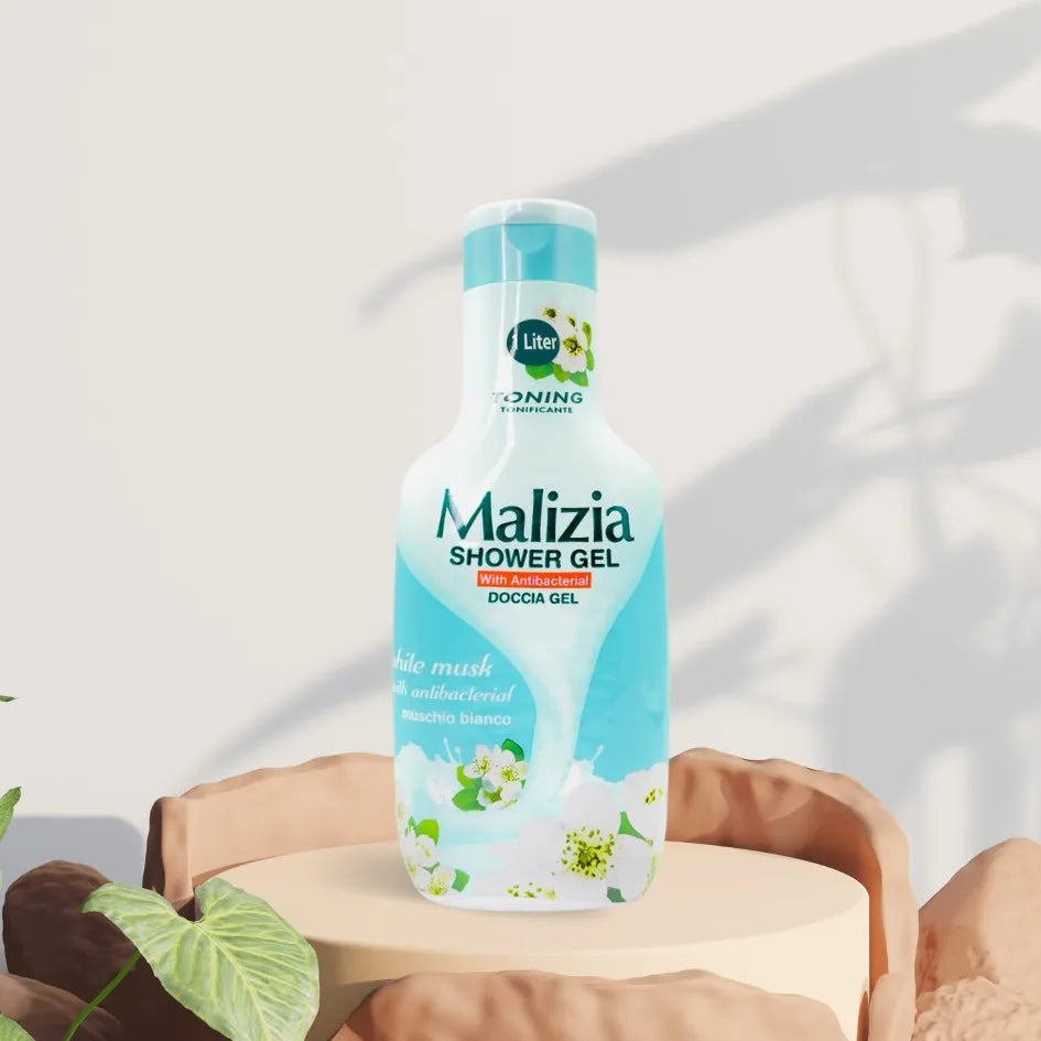 Large white bottle with blue cap and Malizia branding, dispensing white shower gel onto a hand. Text reads "Malizia Antibacterial White Musk Shower Gel 1L