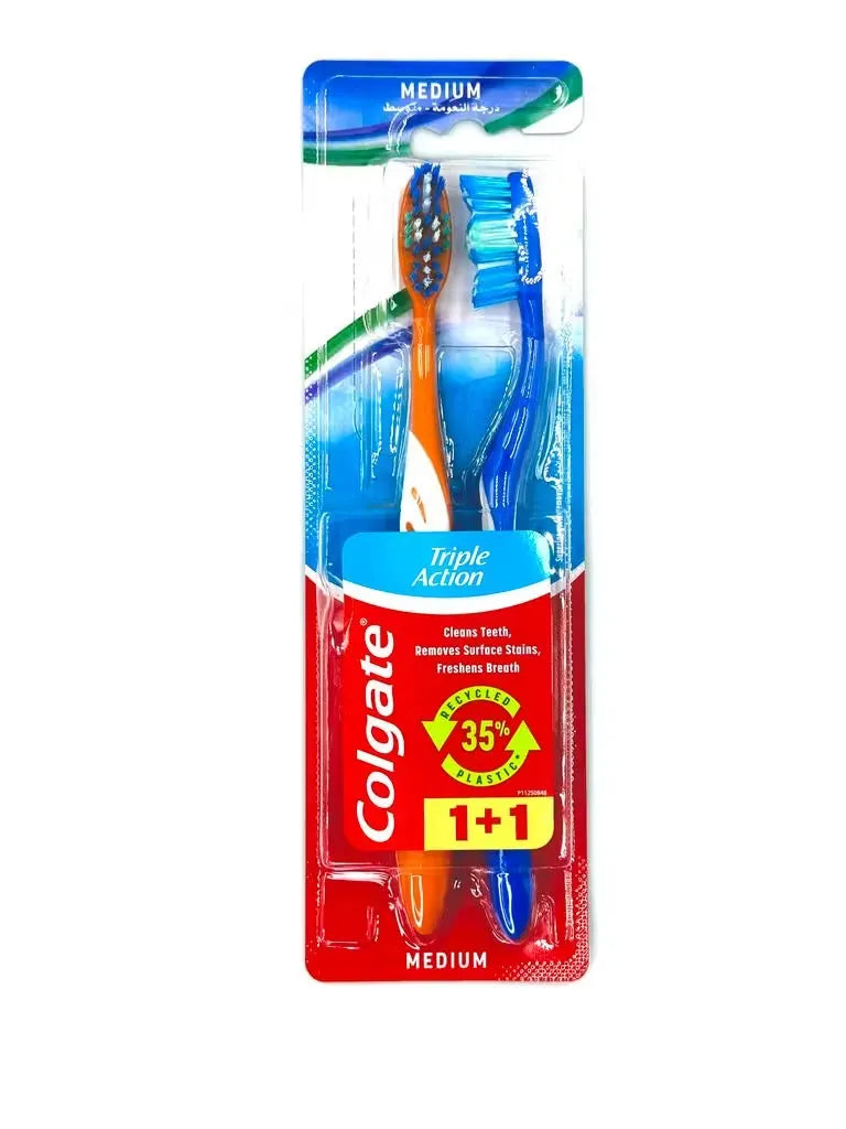 Close-up of two blue Colgate Triple Action toothbrushes with white bristles standing upright in a pack.
