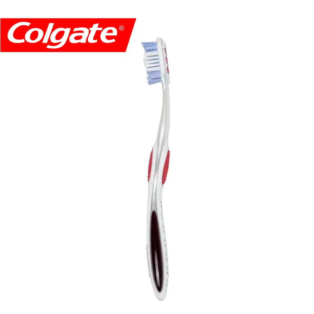 Close-up of red and white Colgate Optic White 360 toothbrush and toothpaste tube, with a focus on the toothbrush and its unique bristle design.