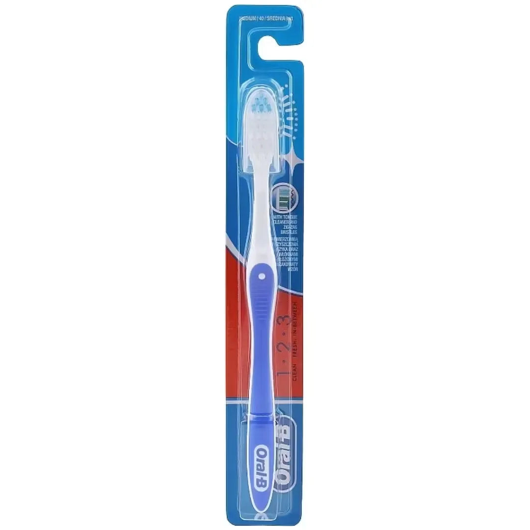 Blue Oral-B Clean, Fresh & Strong toothbrush with medium bristles and a textured tongue cleaner on the back.
