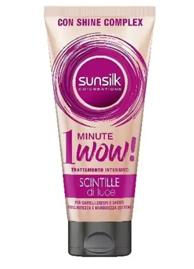 Pink bottle of Sunsilk Shine Complex Intensive Treatment (180ml) with a woman with shiny, flowing hair. The product is being dispensed onto her hand.