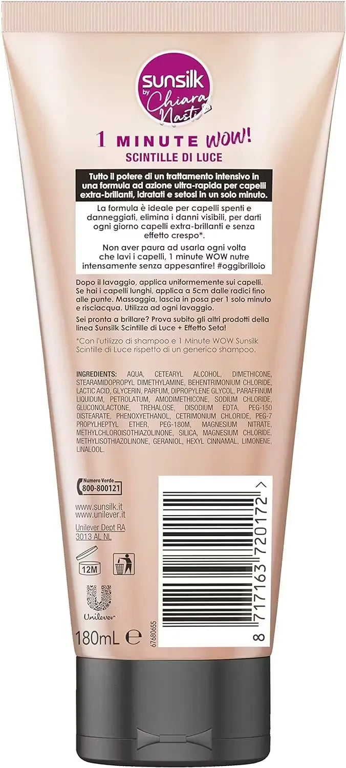 Silver can of L'Oreal Paris Elnett Micro Hairspray (250ml) with a pink nozzle and the text "Normal Hold with Precision Mist." A hand is spraying the hairspray onto styled hair.
