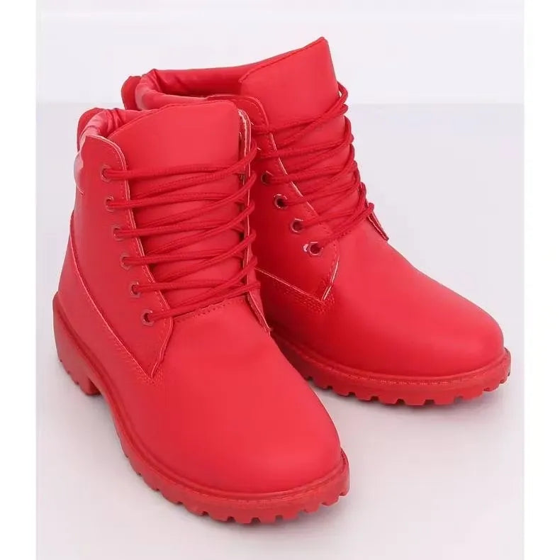 Women's red fashion ankle boots featuring a trendy design and warm lining for winter weather. Shop on Dubailisit! Red ankle boots with winter tread soles, perfect for adding a touch of style to snowy days.