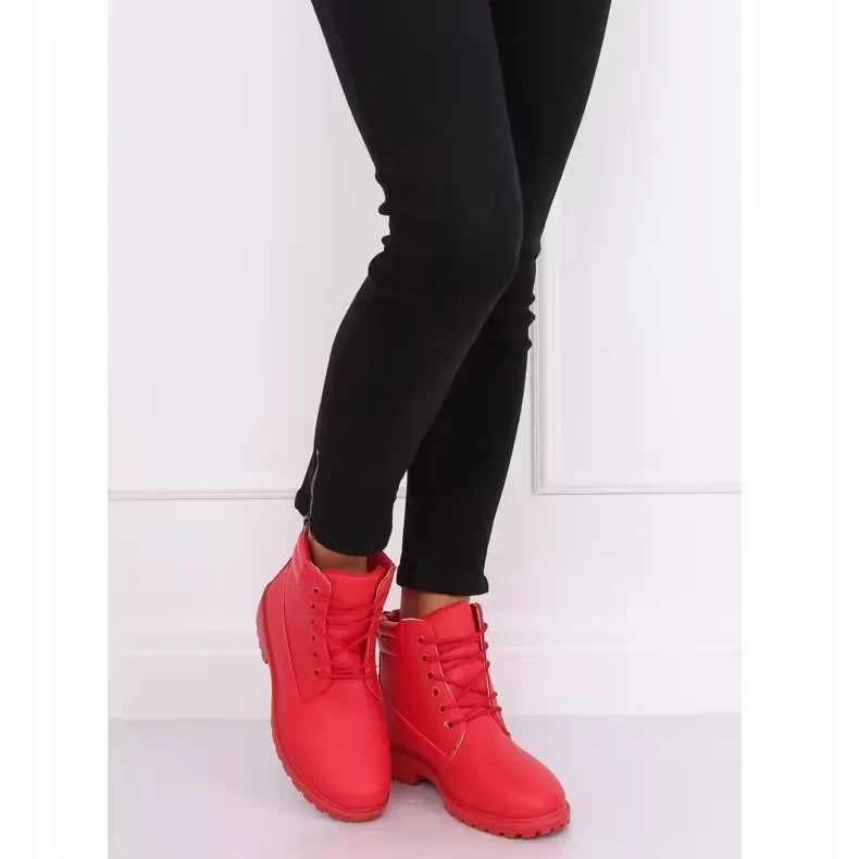 Women's red fashion ankle boots featuring a trendy design and warm lining for winter weather. Shop on Dubailisit! Red ankle boots with winter tread soles, perfect for adding a touch of style to snowy days.