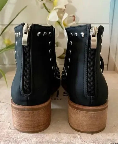 Black Studded Ankle Boots: Elevate your style with edgy & versatile footwear.Pair these versatile boots with dresses, jeans, or skirts.Black, studded, ankle, fashion, trendsetting, comfortable.