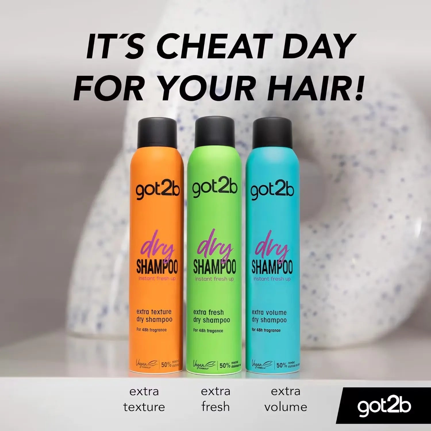 Black can of Schwarzkopf GOT2B Extra Volume Dry Shampoo (200ml) with a model flipping their hair and smiling.