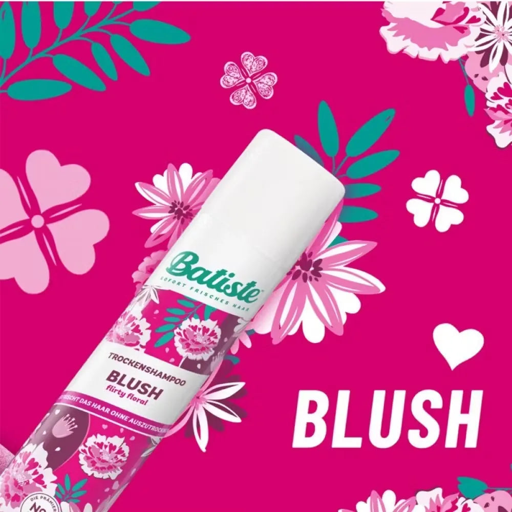Pink and white can of Batiste Dry Shampoo in Blush fragrance (200ml) held in a woman's hand.