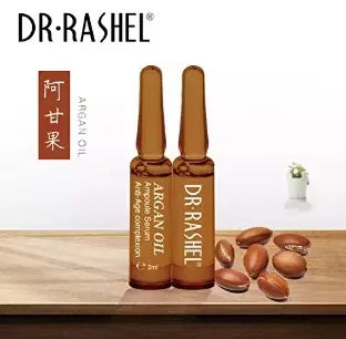Box of Dr. Rashel Argan Oil Complexion Serum with 7 individual ampoules (2ml each). Close-up view of one ampoule with dropper.
