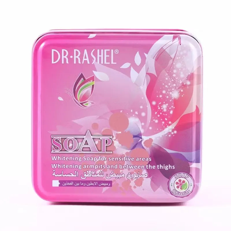 Dr. Rashel Whitening Soap (100g) for gentle underarm and inner thigh whitening. Enriched with natural ingredients for brighter, smoother skin. White bar of Dr. Rashel Whitening Soap with pink accents, lying on a textured surface. Suitable for armpit and thigh care.
