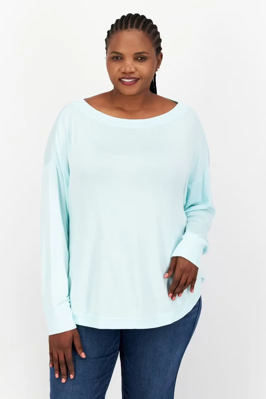 Aqua green, long-sleeve crewneck pullover top made from soft, modal fabric. Model wearing the top with relaxed fit and thumbhole cuffs.
