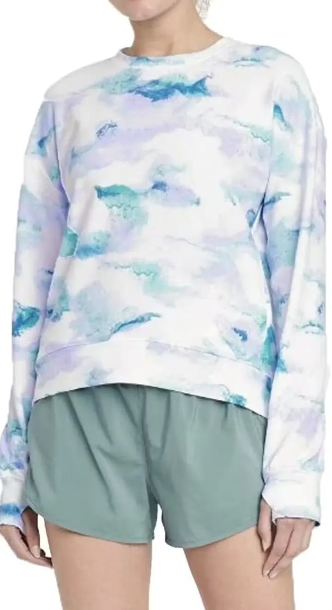Relaxed-fit tie-dye French terry crewneck sweatshirt with side pockets. Model wearing the sweatshirt in a casual pose.