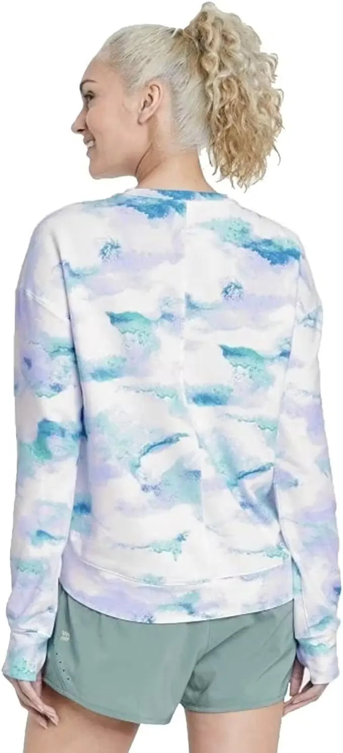 Relaxed-fit tie-dye French terry crewneck sweatshirt with side pockets. Model wearing the sweatshirt in a casual pose.