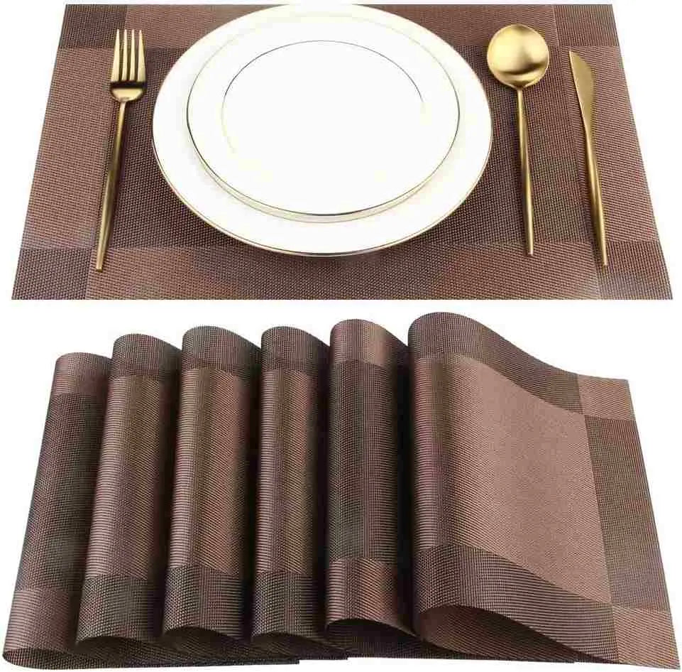 A set of six Kermeo placemats and coasters laid flat on a table. The placemats and coasters are a sleek, modern design with a non-slip texture.