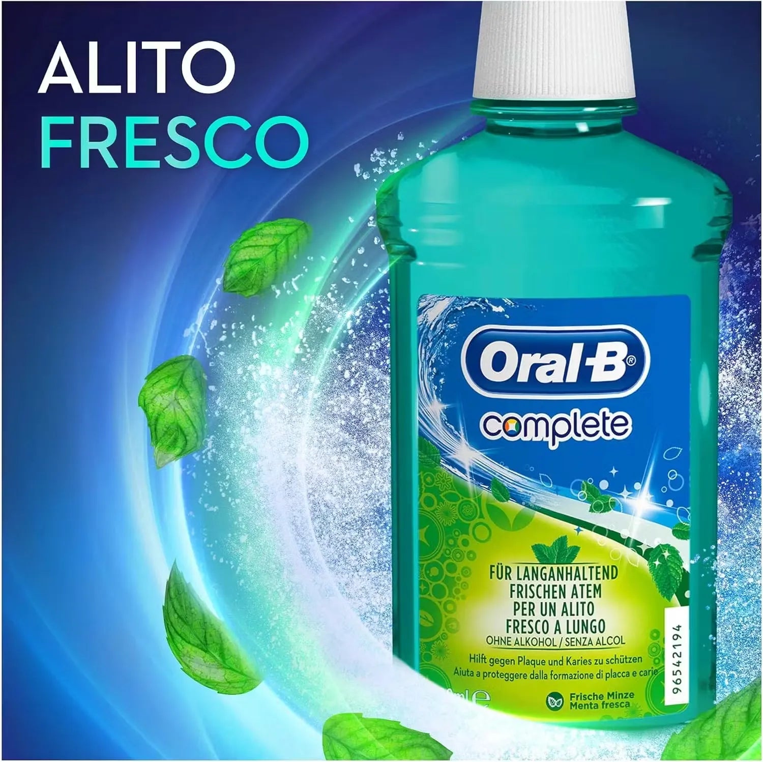 Close-up of a blue plastic bottle with a white pump dispenser labeled "Oral-B Complete Mint Mouthwash" (500ml). A splash of the minty-green liquid is shown pouring out.