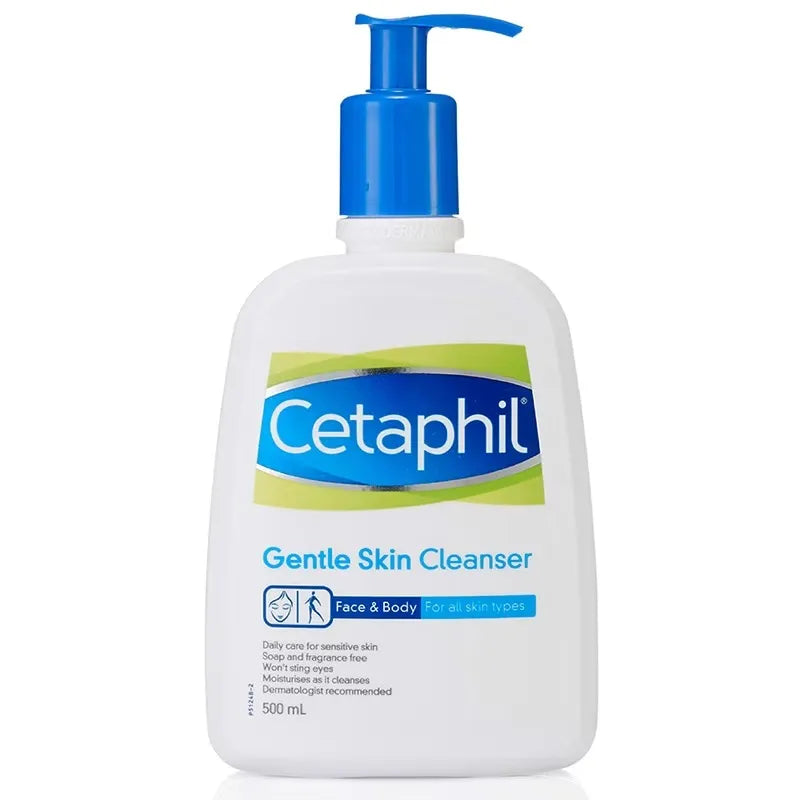 Large white bottle with blue pump dispenser labeled "Cetaphil Gentle Skin Cleanser 500ml." A hand pumps the dispenser, dispensing white cleanser onto another hand.