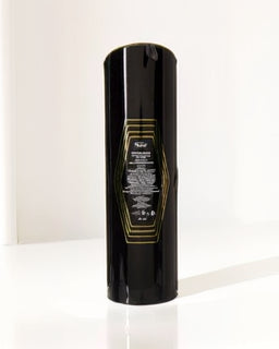 Black perfume bottle with gold text