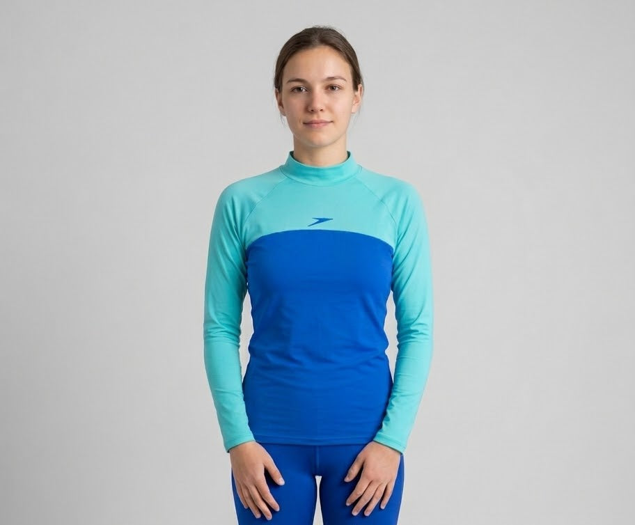 SPEEDO YOUTH Girl long-sleeve rash guard featuring a colorblock design with a blue torso and aqua-green sleeves swimwear ( littel Stained)
