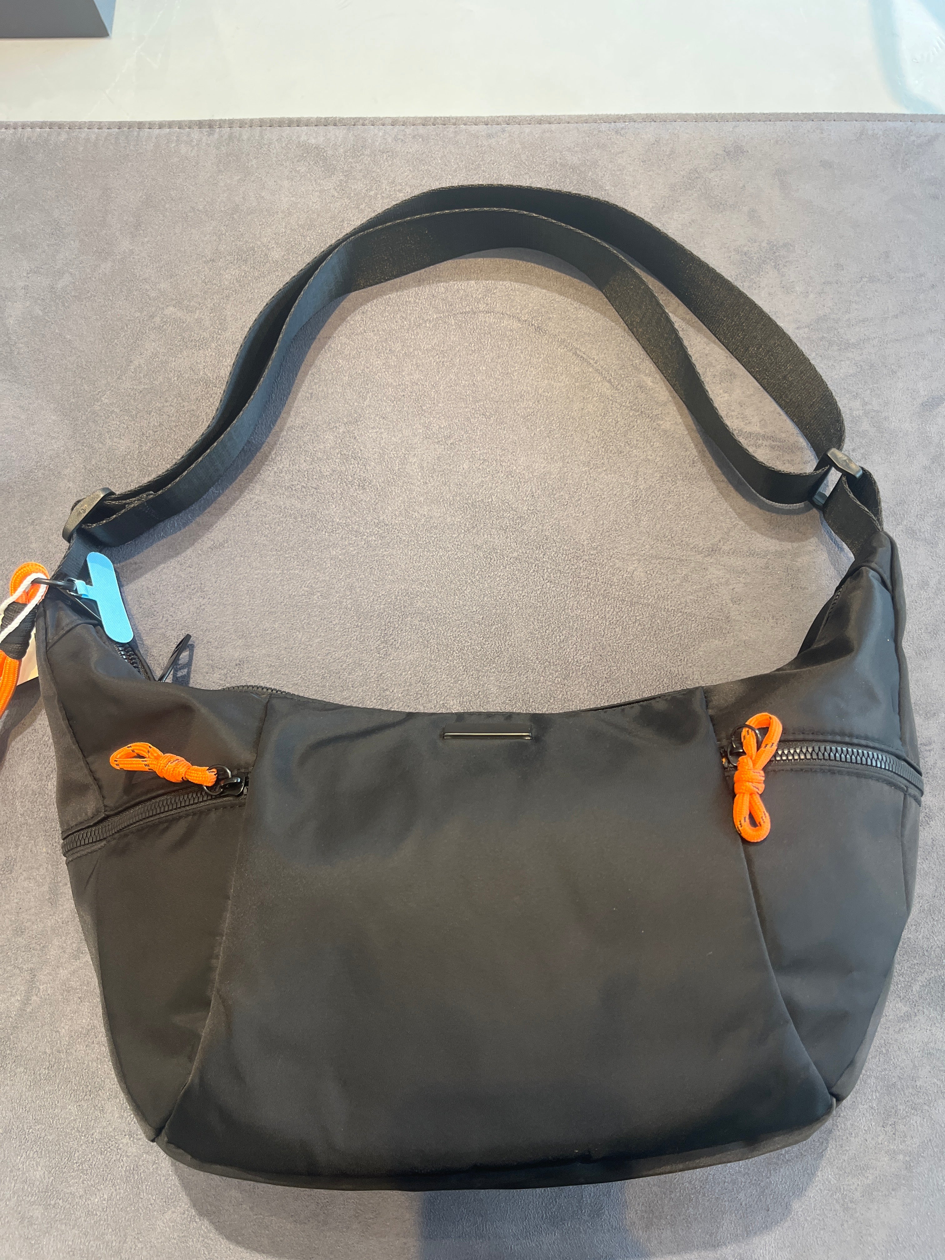 Black Nylon Crescent Crossbody Bag with Orange Pull Accent