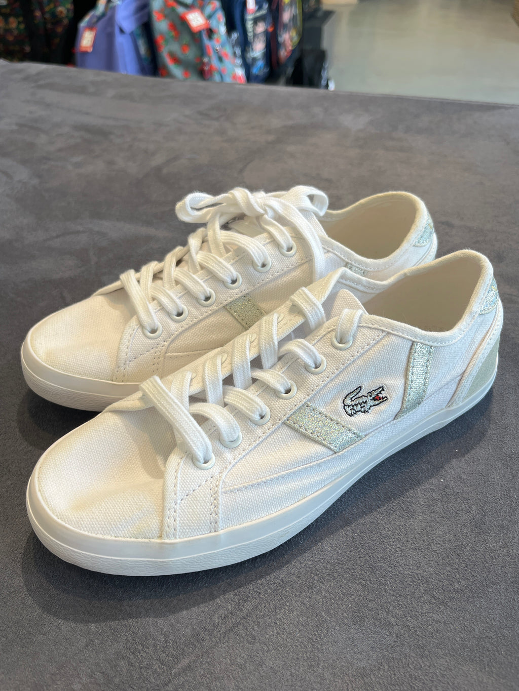 Lacoste Women's White Canvas Sneakers with Metallic Stripe Accents