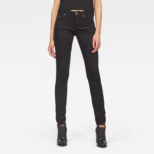 Front view of black skinny jeans with mid waist and skinny fit on a white background